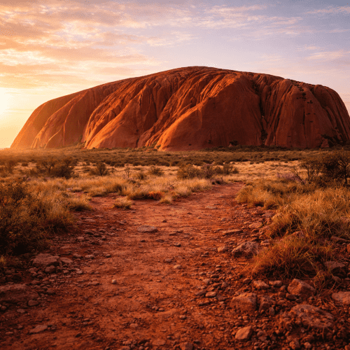 Ayers Rock depicted in vibrant art highlighting its majestic monolith presence and sacred natural significance.