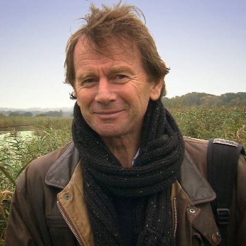 Close-up photo of Michael Wood, British historian and broadcaster, smiling gently.