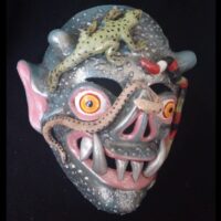 Mythlok - Anchanchu mask Representation of Anchanchu with a lizard resting on its head