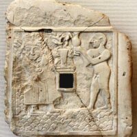 Mythlok - Ninhursag ancient Worn engraving of Ninhursag etched into stone, featuring intricate ancient patterns.