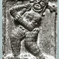 Mythlok - Ogma carving Carving of Ogma holding an object in his hand, symbolizing the gift of language.
