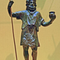 Mythlok - Sucellus statue Statue of Sucellus holding a long-handled hammer and a pot of grain, representing abundance and the harvest.