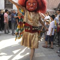 A dancer wearing the traditional Lakhey mask