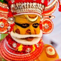 Theyyam dancer as the South Indian hunter god Muthappan